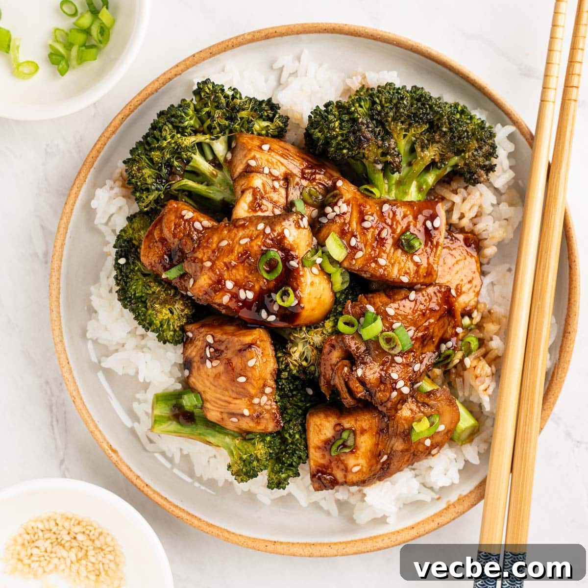 Sheet Pan Teriyaki Chicken and Broccoli Recipe 2 plate of teriyaki chicken and broccoli over white rice.