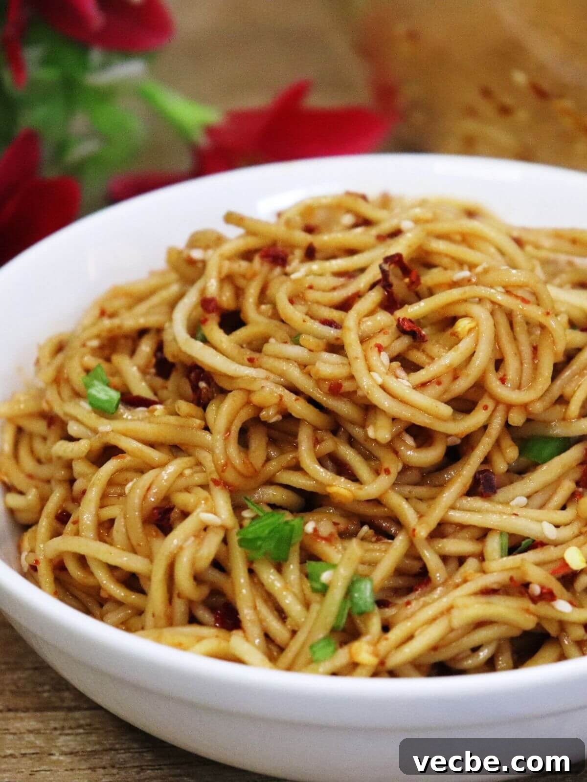15-Minute Garlic Chili Oil Noodles Recipe 2 garlic chili oil noodles served in a white bowl.