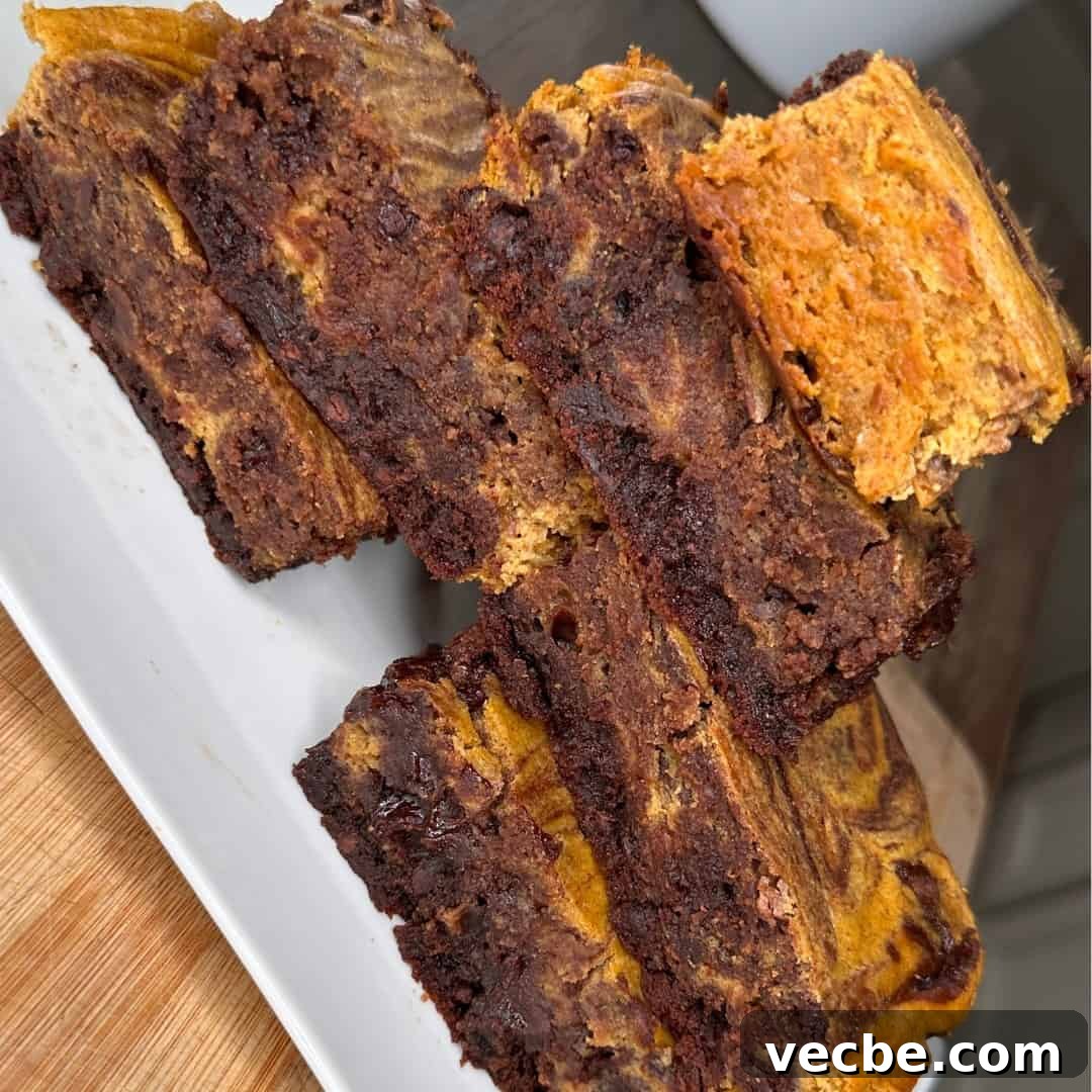 Fudgy Pumpkin Cheesecake Brownies Recipe 4 Homemade pumpkin cheesecake brownies with chocolate chips
