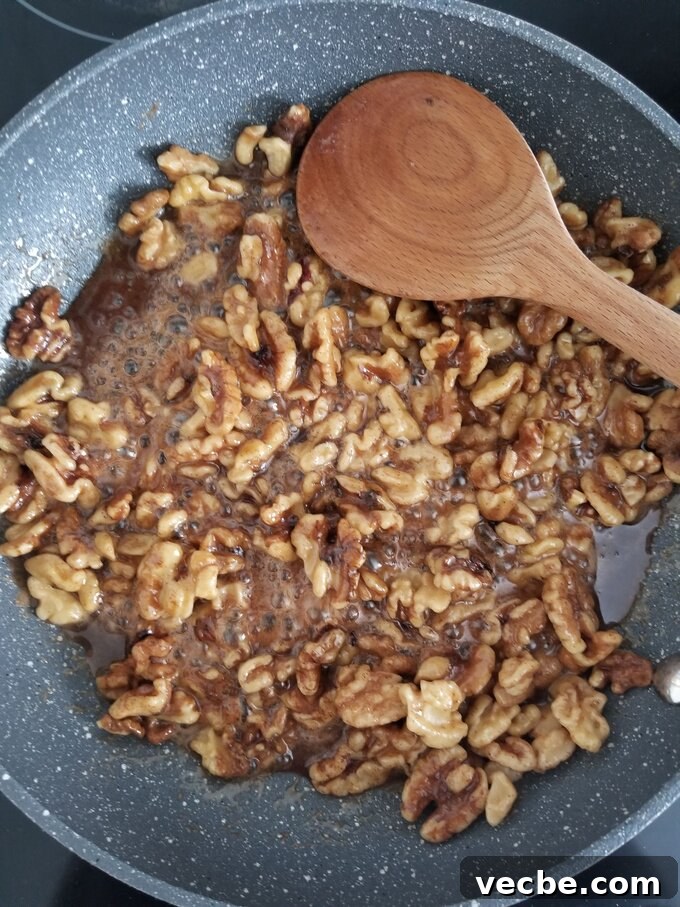 Maple Cinnamon Candied Walnuts Recipe 3 Walnuts cooking in maple cinnamon glaze