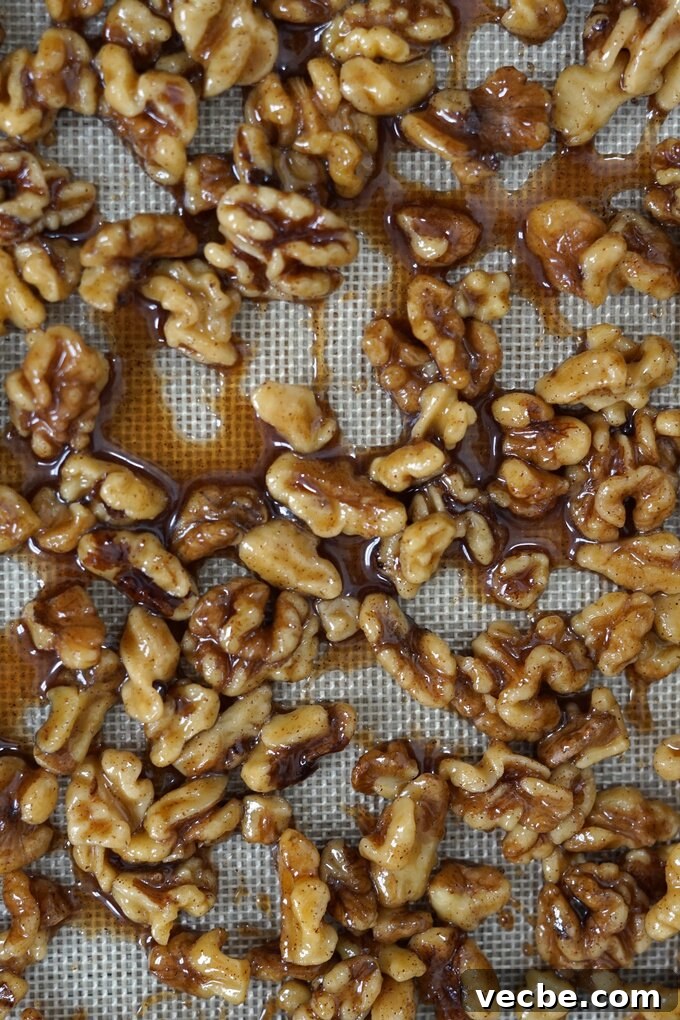 Maple Cinnamon Candied Walnuts Recipe 4 Candied walnuts cooling on parchment paper