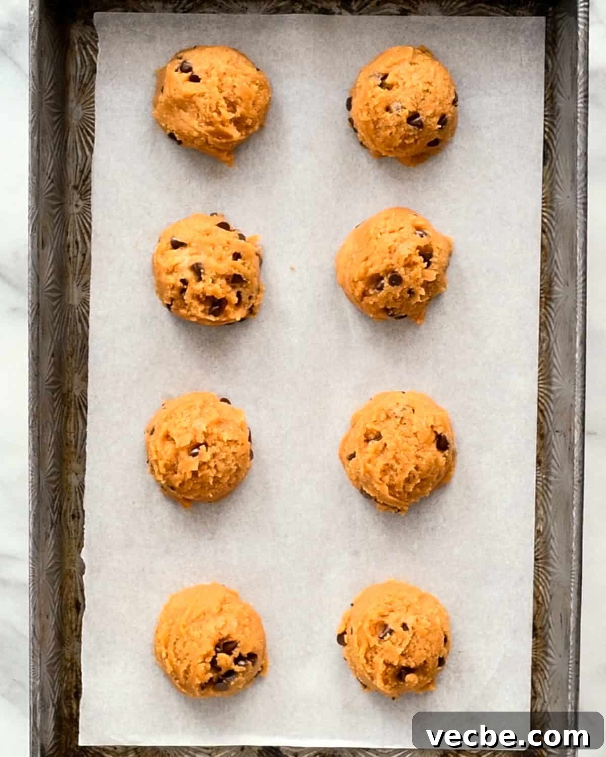 Gluten Free Peanut Butter Blossoms Recipe 8 Gluten Free Peanut Butter Blossoms on a baking sheet before baking