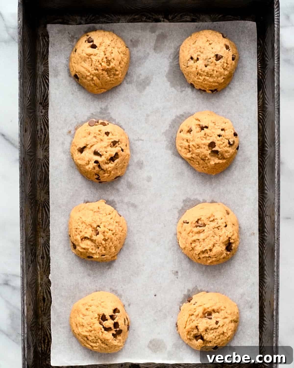 Gluten Free Peanut Butter Blossoms Recipe 9 Gluten Free Peanut Butter Blossoms on a baking sheet after baking