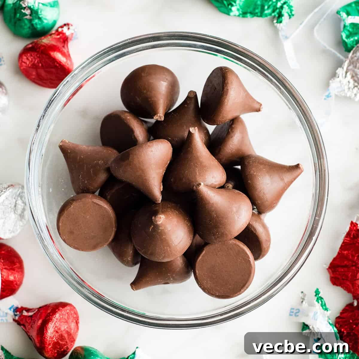 Gluten Free Peanut Butter Blossoms Recipe 3 a bowl of unwrapped hershey kisses to make Gluten Free Peanut Butter Blossoms