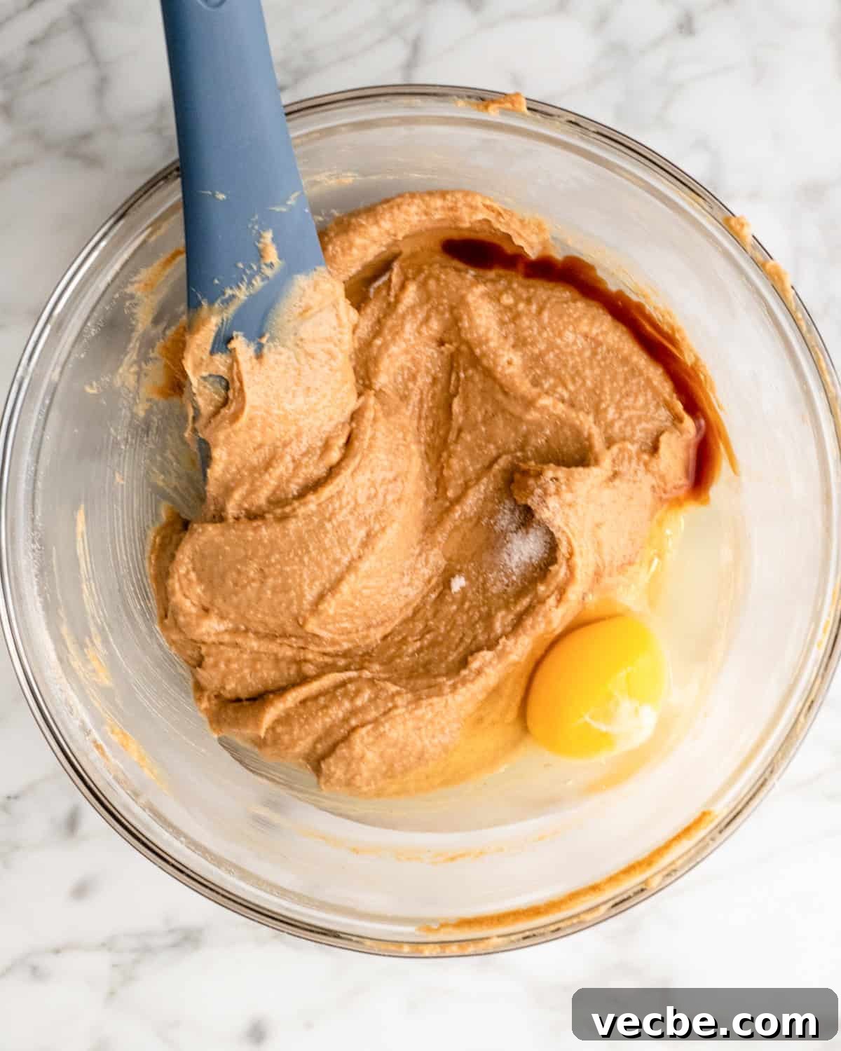 Gluten Free Peanut Butter Blossoms Recipe 5 adding egg, vanilla and salt