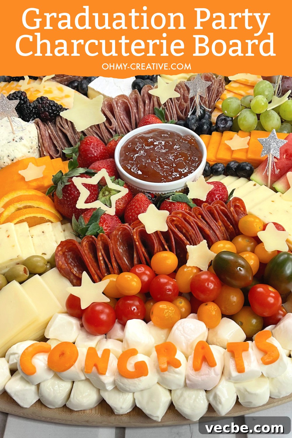 Graduation Charcuterie Board Ideas for Your Party 2 graduation party charcuterie board with the congrats made out of cheeses.