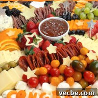 Graduation Charcuterie Board Ideas for Your Party 6 graduation party charcuterie board with the congrats made out of cheeses.