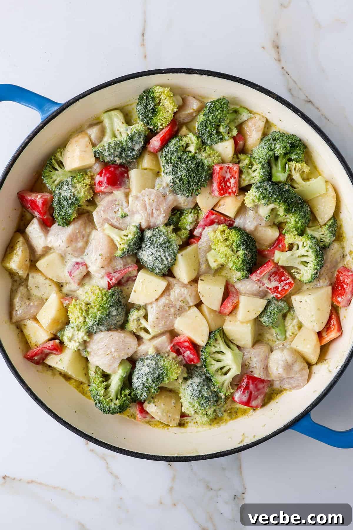 Creamy Baked Chicken, Broccoli and Potato Casserole 6 Everything mixed together in a casserole dish.