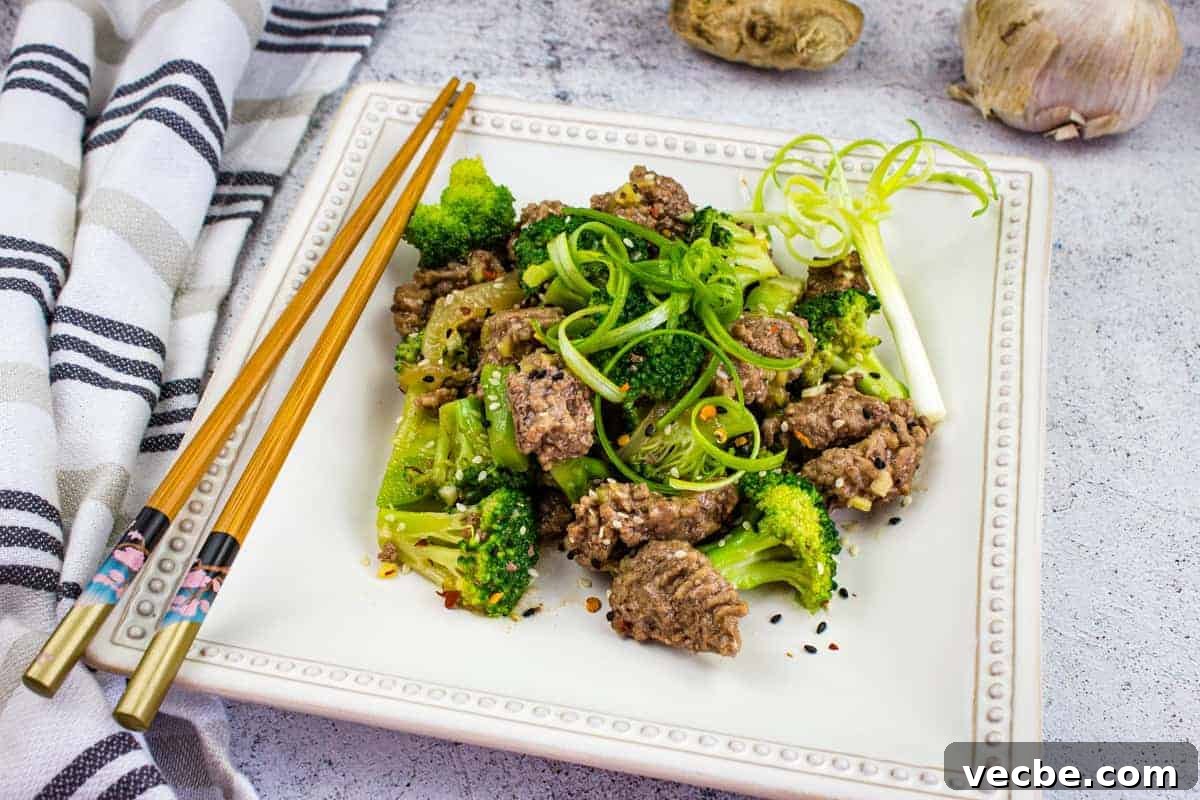 25 Ground Beef Recipes for Real Weeknight Dinners 23 A plate of beef and broccoli with chopsticks.