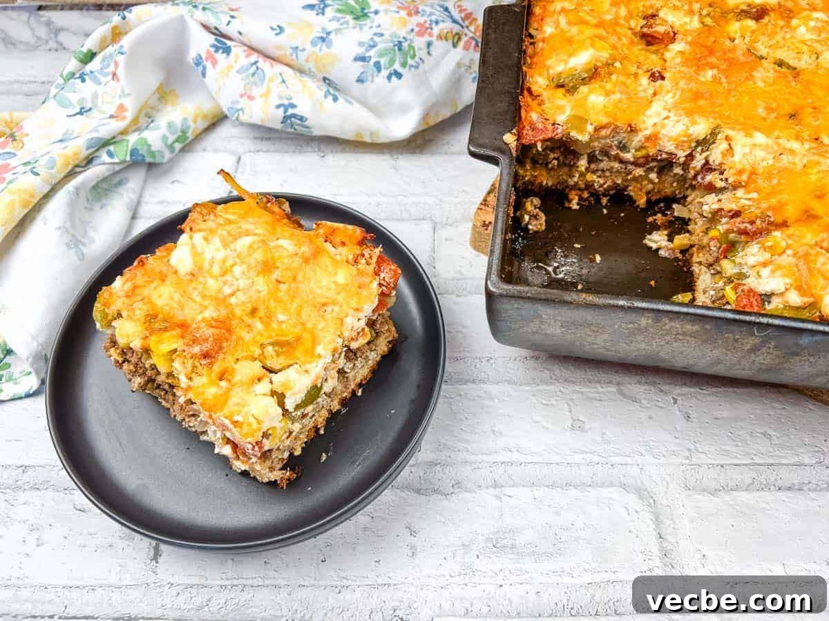 25 Ground Beef Recipes for Real Weeknight Dinners 27 A slice of John Wayne casserole on a black plate beside a baking dish of the same casserole.
