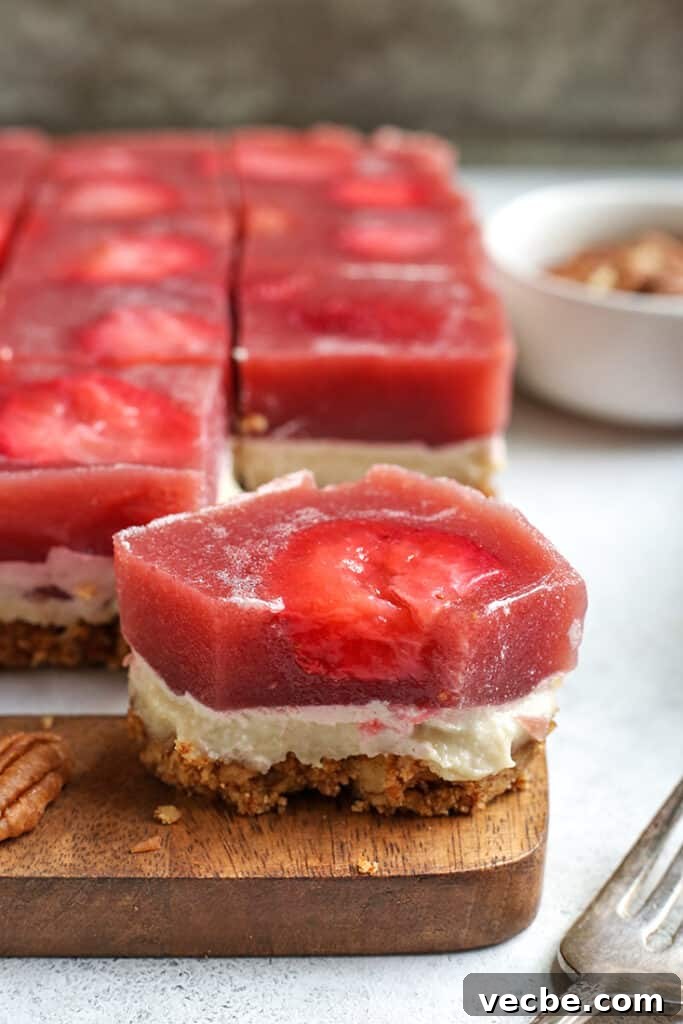 No Bake Paleo Strawberry Pretzel Salad Recipe 2 piece of grain free strawberry pretzel salad with a bite taken out