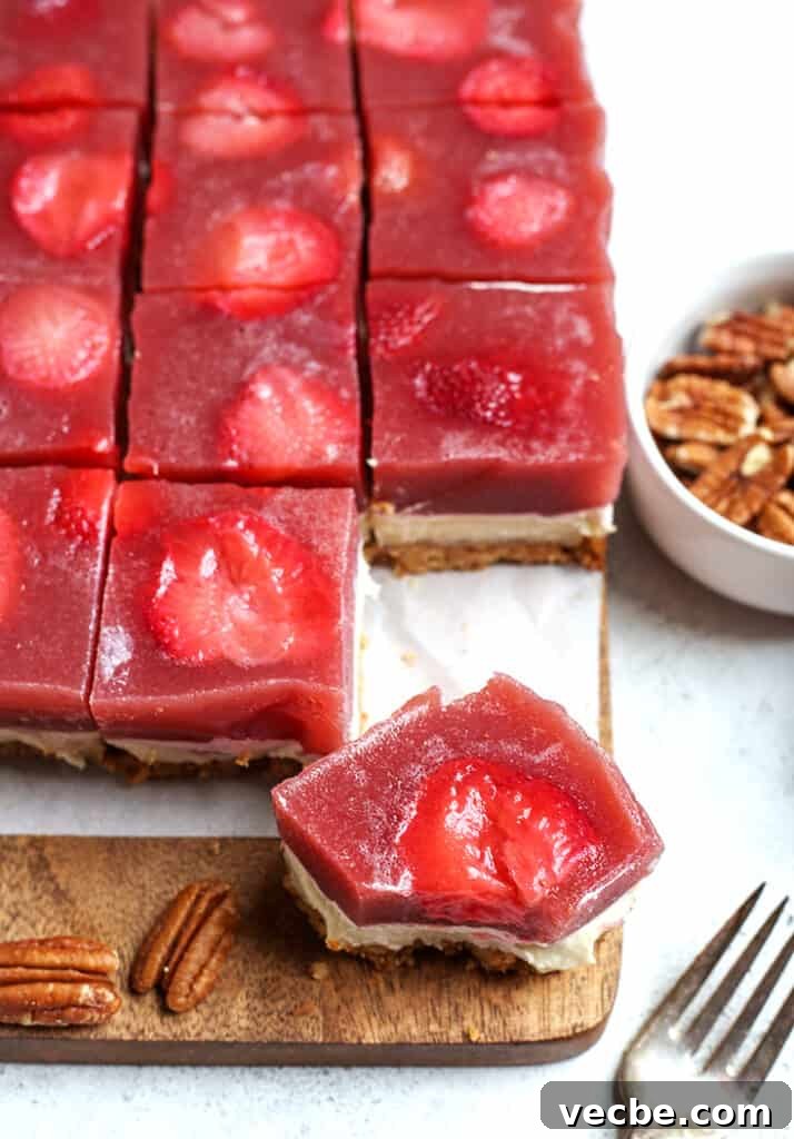 No Bake Paleo Strawberry Pretzel Salad Recipe 6 paleo strawberry pretzel salad pieces, one with a bite taken out