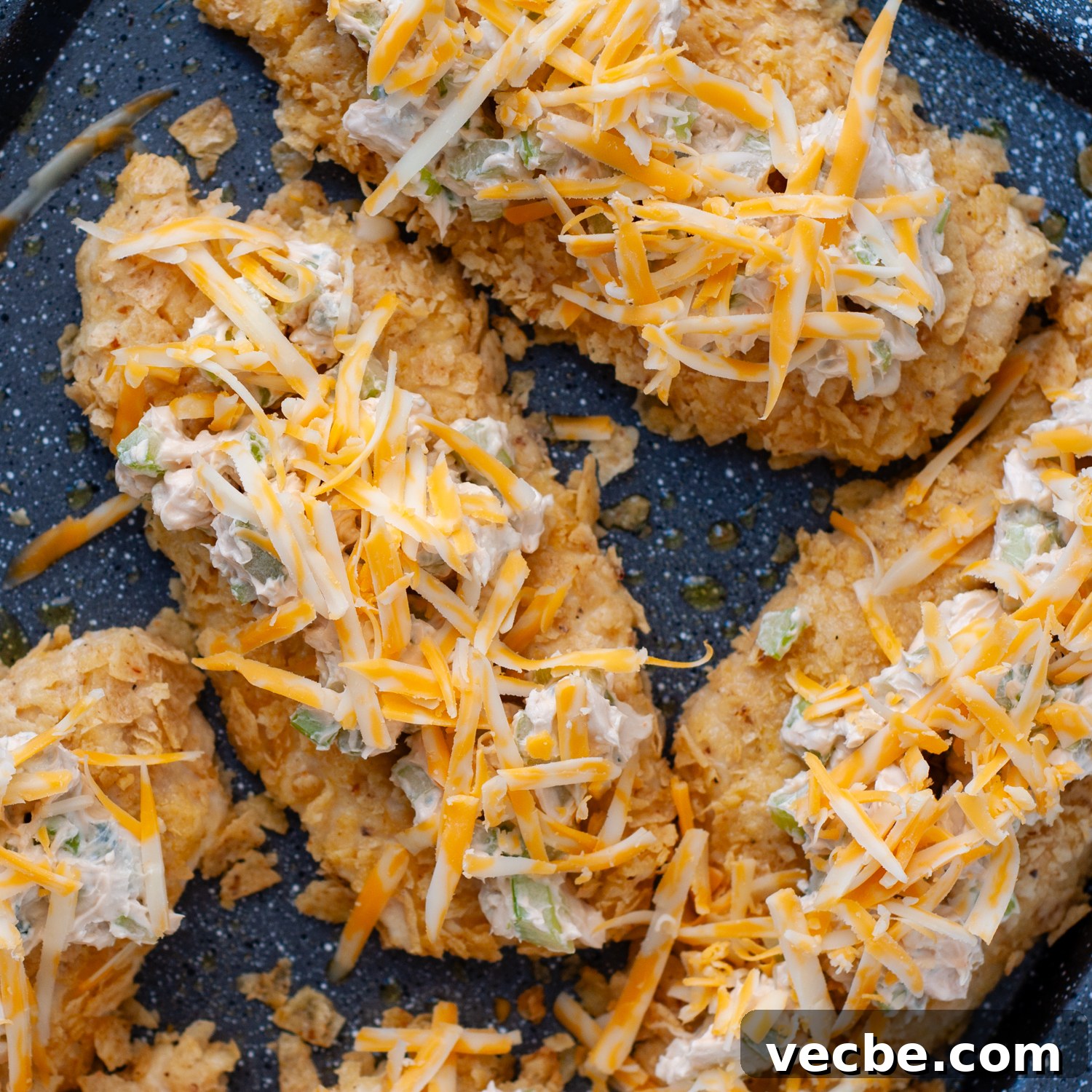 Buffalo Chicken Bake with Tortilla Chip Crust 8 cheese on top of chicken before melting.