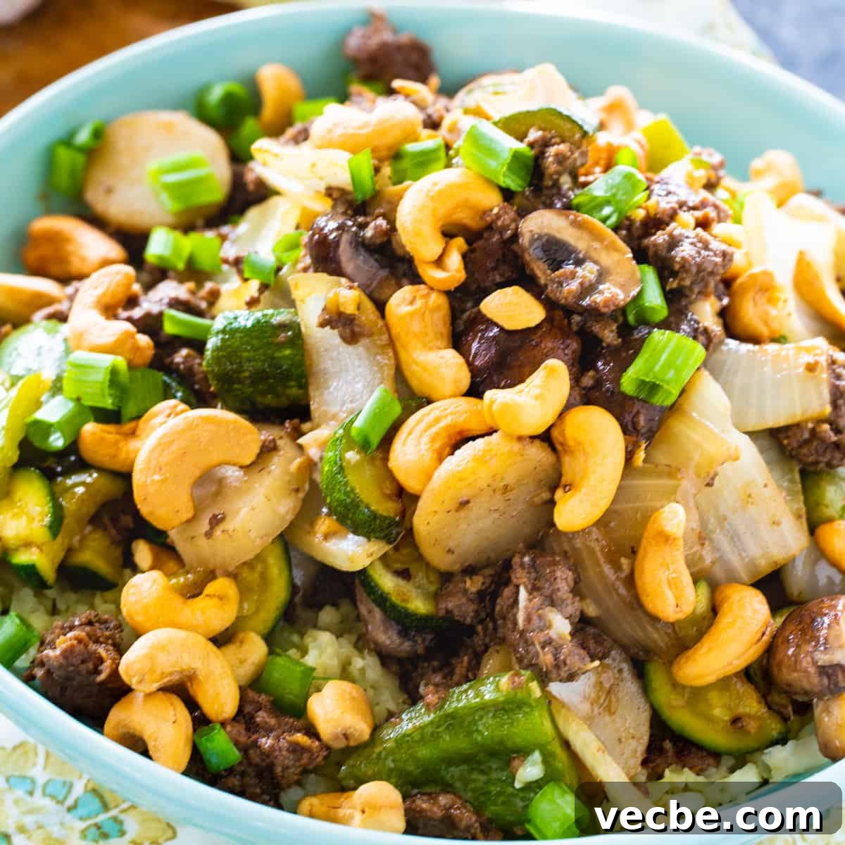 Keto Cashew Beef Stir-Fry 2 Keto Cashew Beef in a light blue bowl.