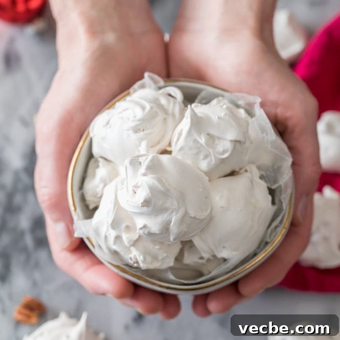 Sea Foam: What Causes It, Is It Safe, and How It Forms 2 Hands holding seafoam in bowl