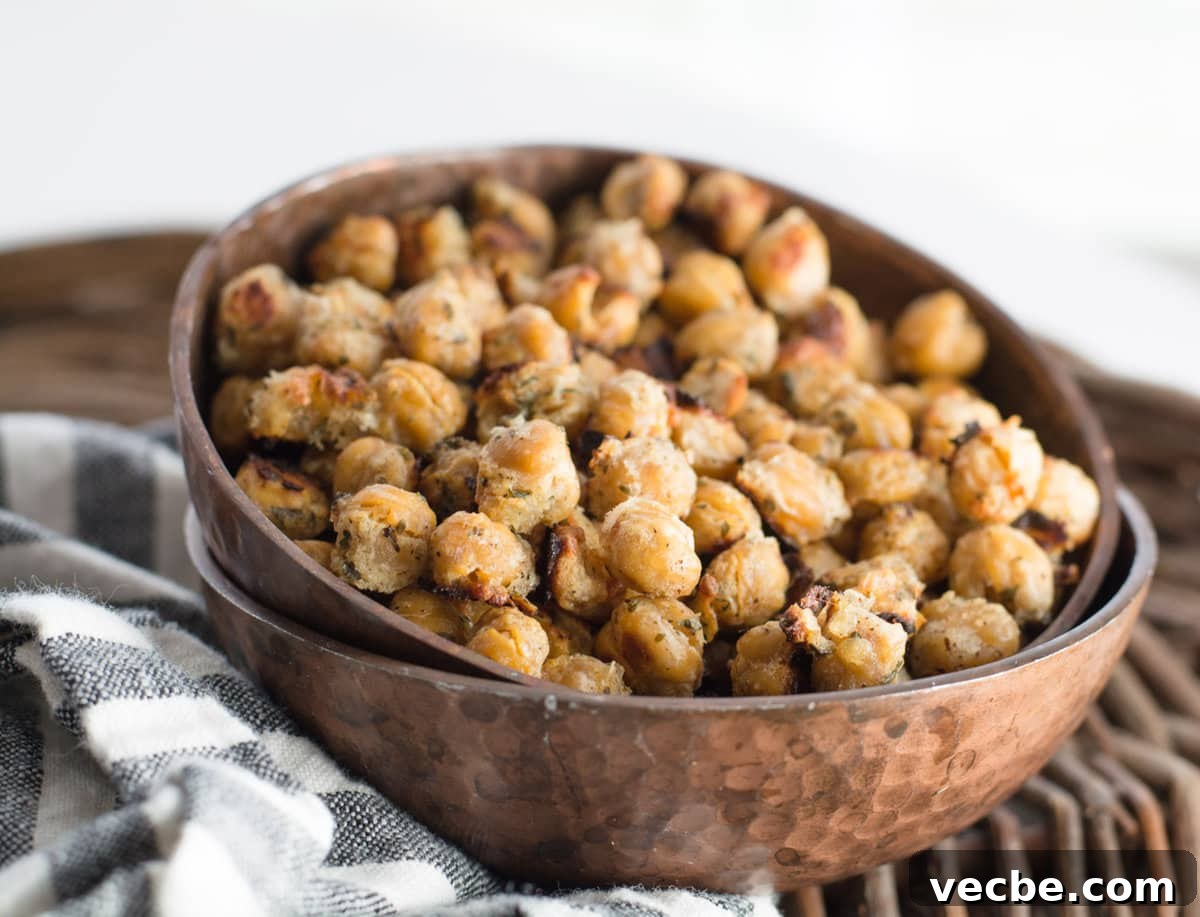 Crispy Ranch-Roasted Chickpeas 3 oven roasted chickpeas in a bowl, which is stacked in another bowl