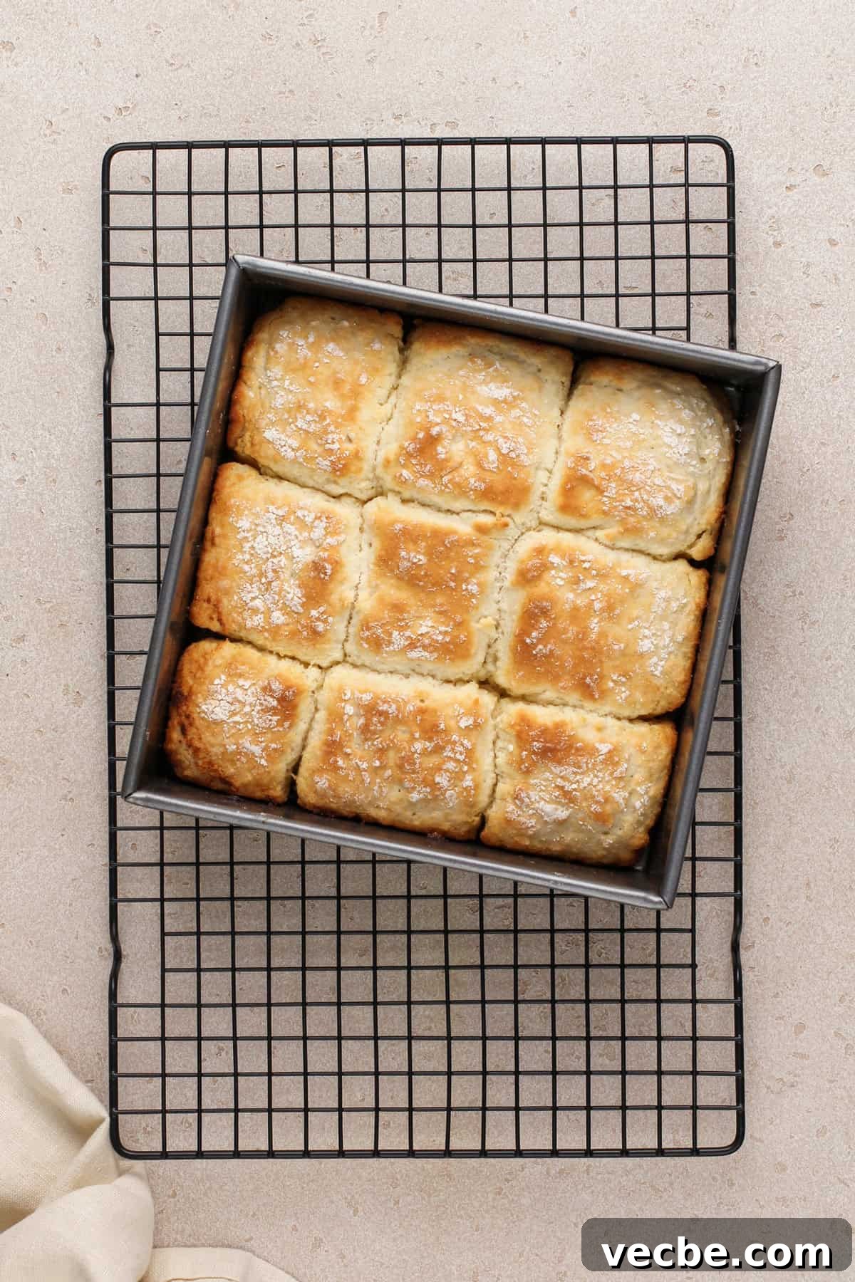 Fluffy 7-Up Biscuits Recipe 8 Baked 7up biscuits cooling on a wire rack.
