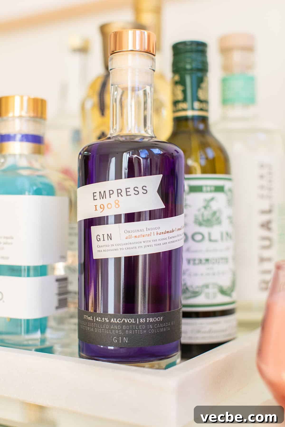 Empress Gin Cocktail Recipes to Try Tonight 2 Bottle of Empress gin on a bar cart