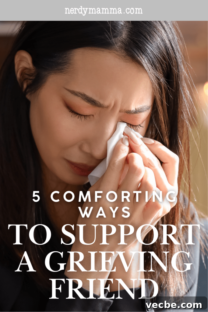 5 Compassionate Ways to Support a Friend Who's Grieving 4 A woman wipes away tears in a moment of deep grief, highlighting the emotional weight of loss and the need for support.