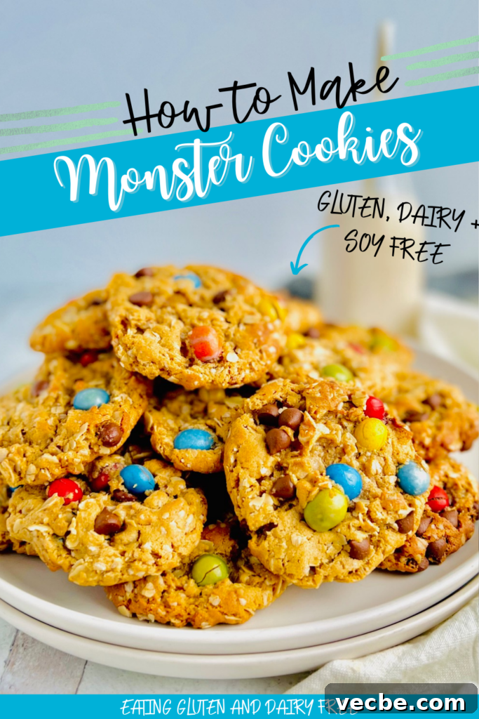 Chewy Monster Cookies with Chocolate Chips and Peanut Butter 2 A white plate full of cookies with oats, creamy peanut butter, chocolate morsels, and chocolate candies.