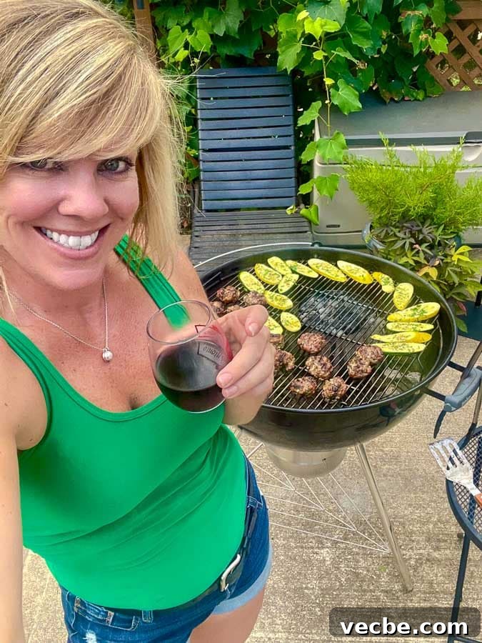 Grilled Italian Meatballs Recipe 3 Jennifer in front of a grill making Italian meatballs